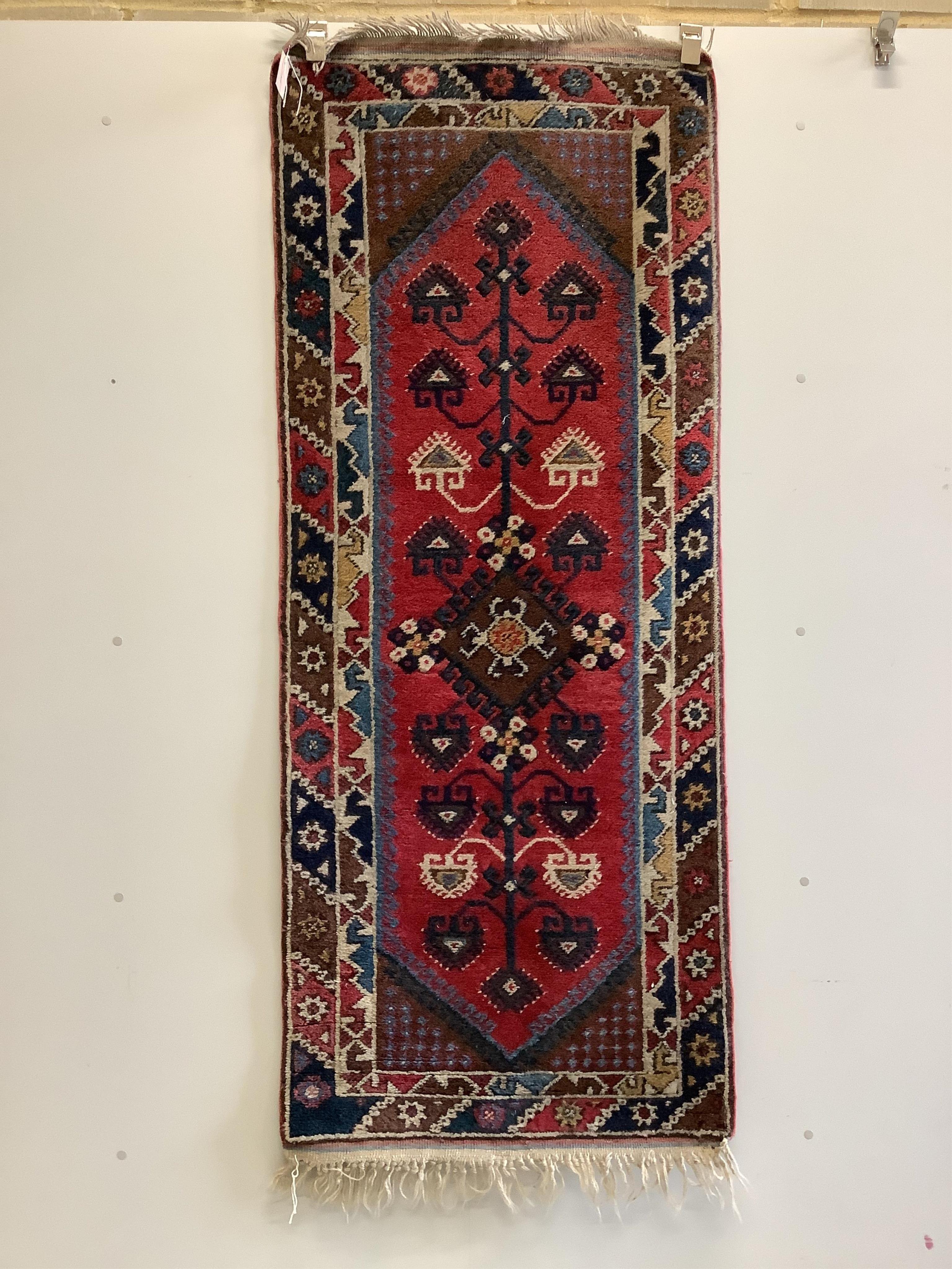 Three Caucasian style red ground runners, largest 290 x 72cm. Condition - fair
